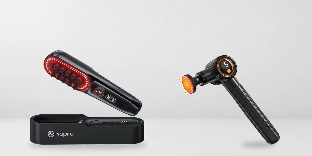 Black NAPRE scalp massager with its base alongside a NAPRE massage gun on a light gray background